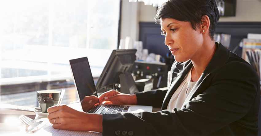 A person sitting at a desk deep in consideration.